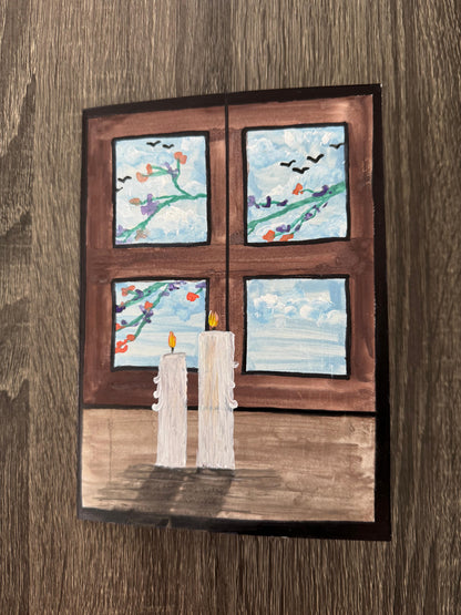 Artistic depiction of a window with four panes showing different scenes, with two candles in the foreground.